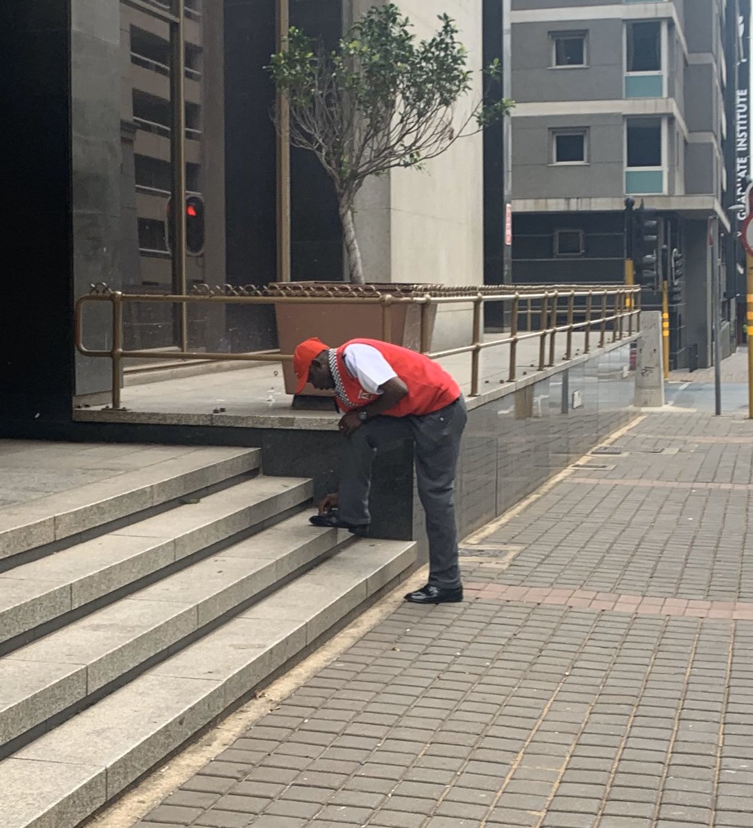 timothymaurice's tweet photo. Walked to pharmacy and saw this security guard polishing his shoes.  So many unsung heroes during this time, keeping us safe and doing so with pride!  #Day6OfLockdown https://t.co/FWBvpIMkKj