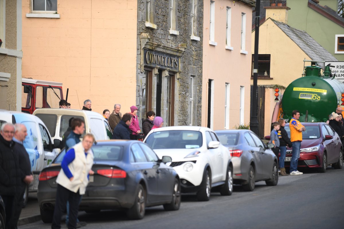 cooney_ian's tweet photo. The poignant scene in Creggs this morning as locals gather to rally behind the Connelly family as they make their way to Ballycumber to take their beloved Conor on his final journey #GAA #rosgaa https://t.co/le5MaTsJxL