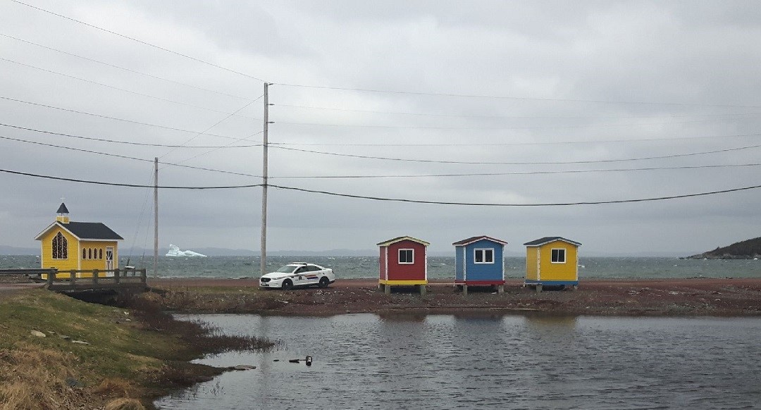 RCMPNL's tweet photo. During #Covid19 we are better together when we stay apart. Even though it may be easy to guess this month’s cover photo location, we thought the colorful row houses are a great example of #PhysicalDistancing. Show us how you keep your distance. #WhereWeWork #YourRCMPNL https://t.co/lNGpfhJJy6