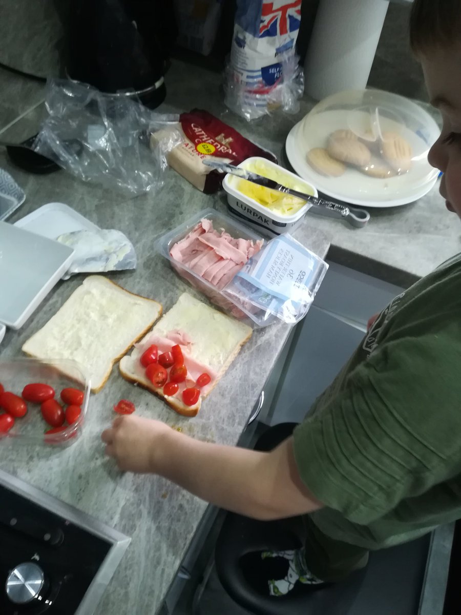 Clbrowes's tweet photo. Reuben has made his sandwich. Ham and tomatoes his choice. It made two squares and counted out the ham slices and tomatoes https://t.co/QBFUjpfxGc