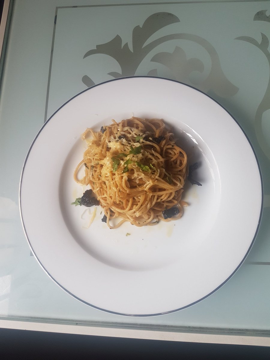 Quarantine cuisineLunchPasta aglio e olio with sun dried tomatoes and grated cheese