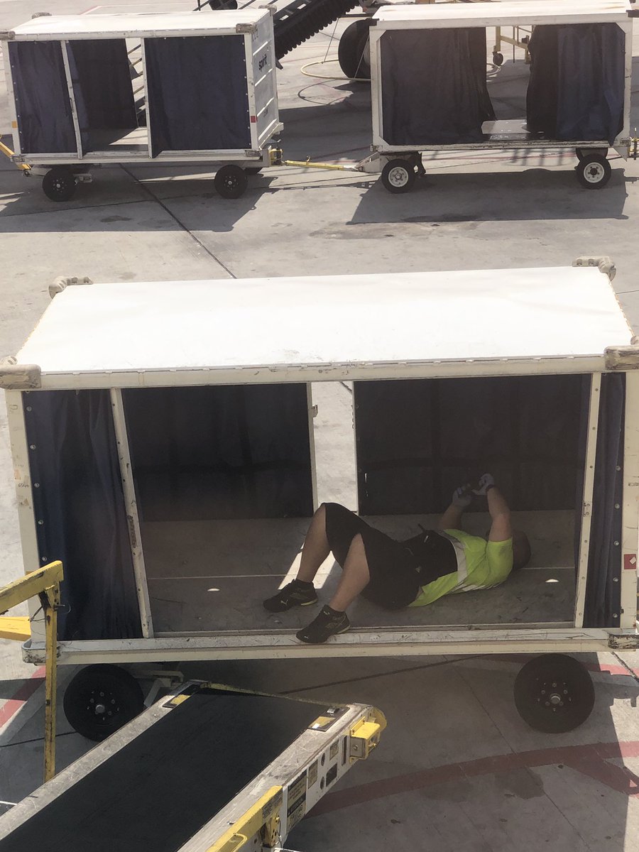 jenandeddy's tweet photo. That moment when an @SpiritAirlines employee @FLLFlyer is on the cell phone laying in a cargo vehicle. #nothingtodo #COVIDー19 #staysafe https://t.co/gfRGzC8SLz