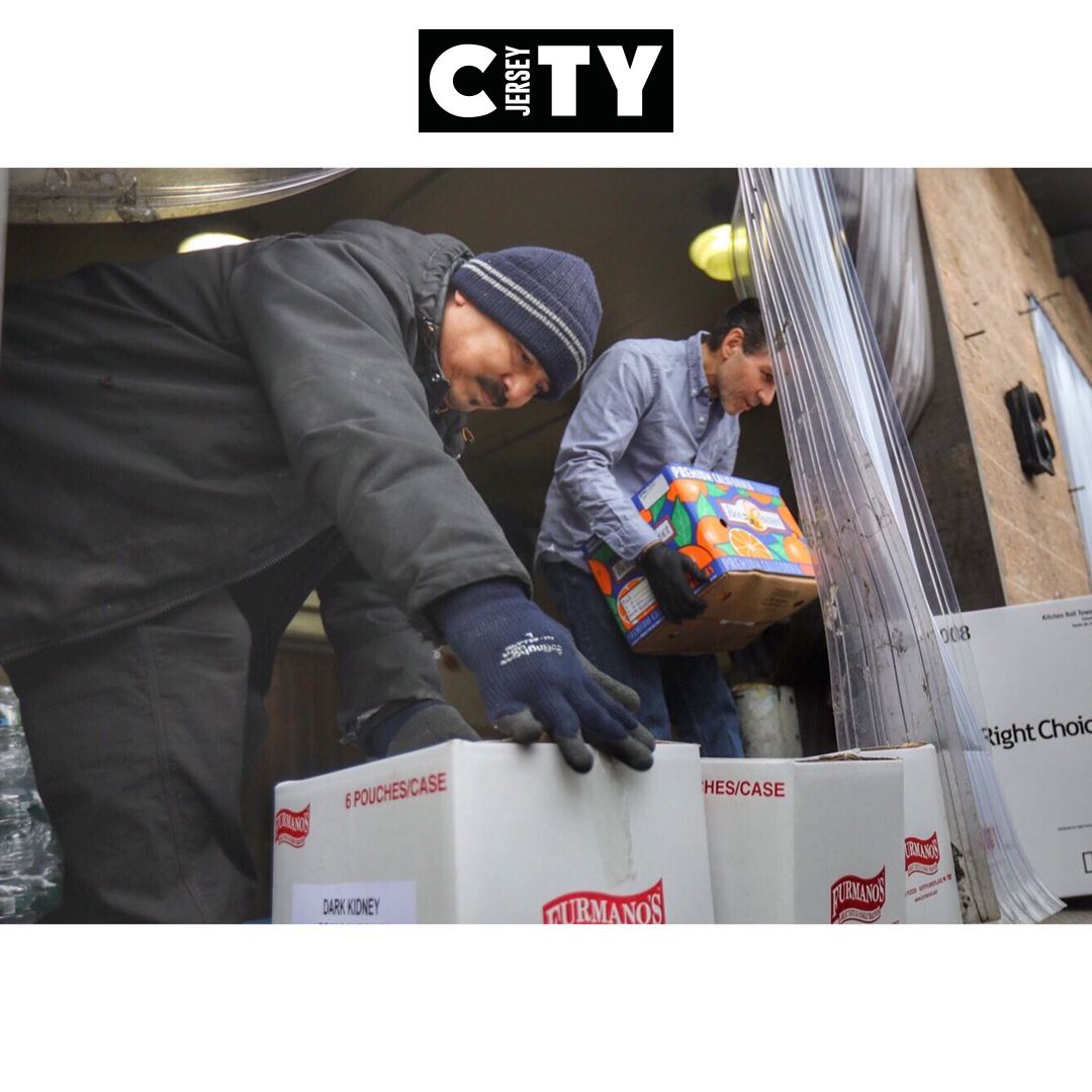#JerseyCity distributor <a href="/WoolcoFoods/">Woolco Foods</a> Inc. helps load a donation of produce, water, paper products and other food into a Health &amp; Human Services Bus <a href="/HealthierJC/">Healthier JC</a>. The food is for Grandview Terrace Senior Apts., supplementing the meals program during the pandemic. #JCresponds