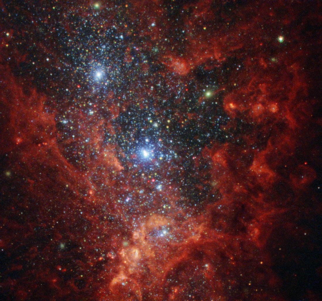 A region in NGC 1569, a little galaxy about 11 million light years away in Draco. Gas in the galaxy is compressed by gravitational interactions with the larger IC 342 galaxy group, driving rapid star formation.Image: ESA/Hubble & NASA, Aloisi, FordAcknowledgement: Judy Schmidt