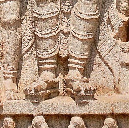 Both Shri Rama & Lakshmana wear the Kiritamukuta(crown), hold Kodanda(bow) with their left arms & with their right arms gently embracing the figures next to them. Here's where the shilpi has left us a major clue. Observe the feet. Rama's feet r missing Padaraksha(footwear)(2)