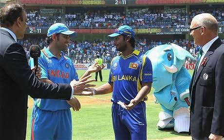 Talismanic Dhoni spins the coin up into the air. Sanga calls Tails?! Wait?! The noise in the ground defeans the match referee. Sanga suggests to toss again. Sanga calls Heads this time, and Heads it is. Ind loss the toss and will have to chase the history to lift the cup. 2/n