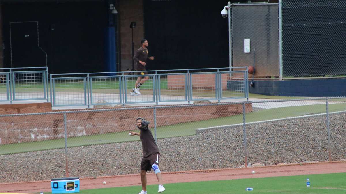 Fernando Tatis Jr. warming up as teammates get loose behind him playing basketball, Kirby Yates, MacKenzie Gore, Luis Patino as the rain starts to pick up  #Padres 3-11-20