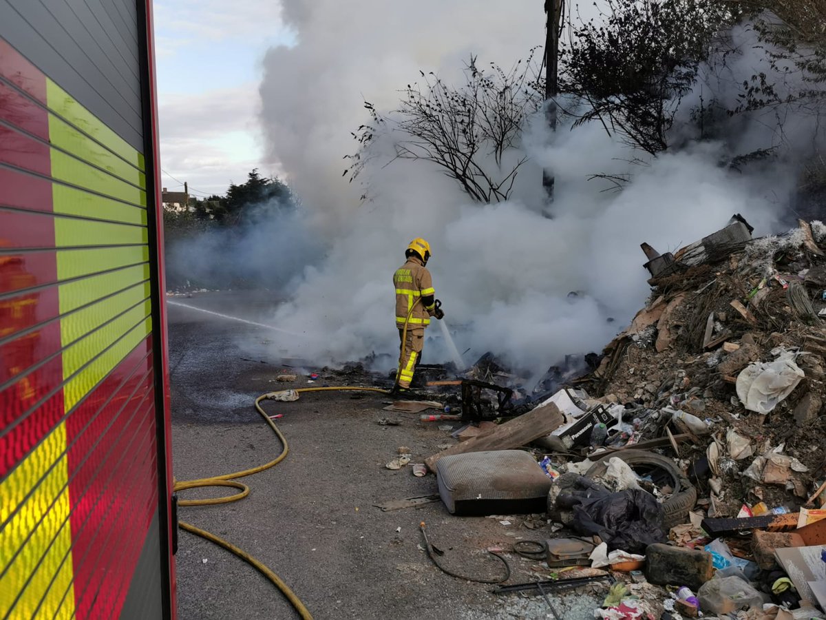 DubFireBrigade's tweet photo. If you take advantage of the offer made on flyers like these, or use unlicensed waste collectors, this is generally what happens. 

Dumped on the side of the road and burned. 

This fire was extinguished last night by Firefighters from Finglas. https://t.co/sDjYrPMnyd