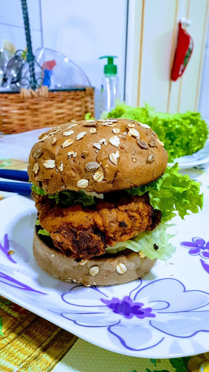 Fried chicken sandwich in multicereal bun with lettuce and pickle tartar sauce #foodNERDS