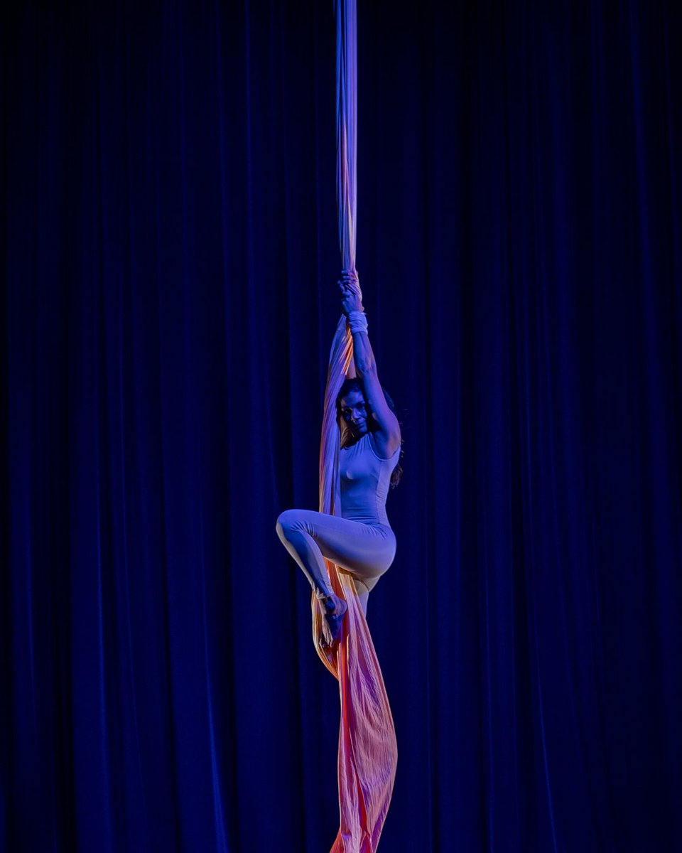 Parapride's tweet photo. "Mel Stevens of @aimtoflyuk becomes weightless, leaving behind her crutches to swing and twirl on aerial silks.

"The beauty of the story she portrays is one of passion and overcoming the many twists and turns life can throw at you."
@ayoungertheatre

#TBT #ThrowbackThursday https://t.co/OQITxlpUKJ