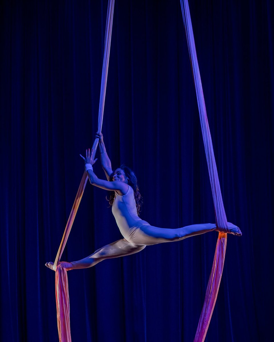 Parapride's tweet photo. "Mel Stevens of @aimtoflyuk becomes weightless, leaving behind her crutches to swing and twirl on aerial silks.

"The beauty of the story she portrays is one of passion and overcoming the many twists and turns life can throw at you."
@ayoungertheatre

#TBT #ThrowbackThursday https://t.co/OQITxlpUKJ