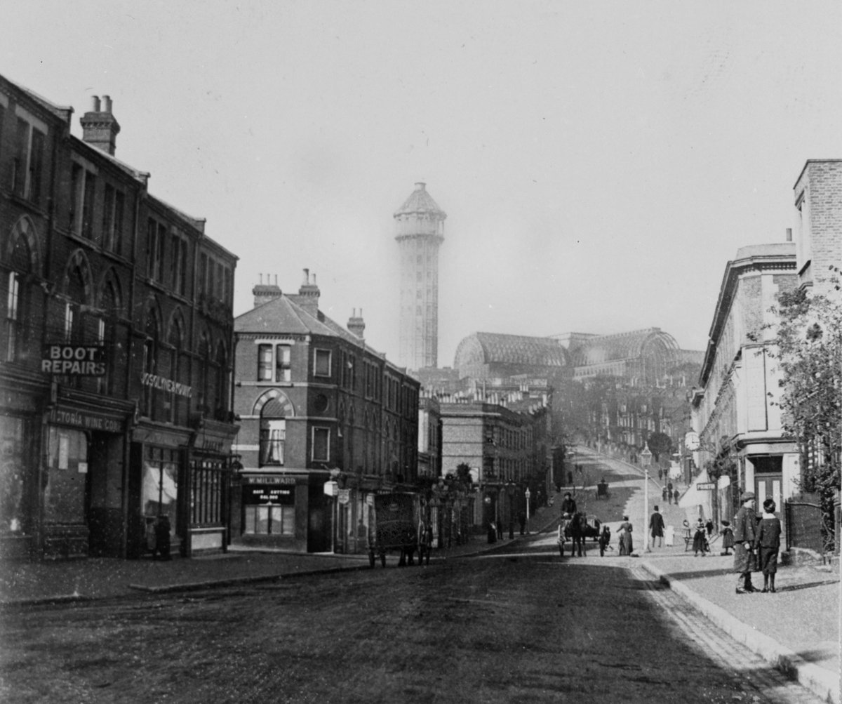 Jen: COPY1/437 - a view of the Crystal Palace from Anerley Road. The photograph was taken near where I live today, but in 1898. I always think the Palace up on the hill has an almost ethereal quality, & I desperately wish I’d been there to see it in the flesh.