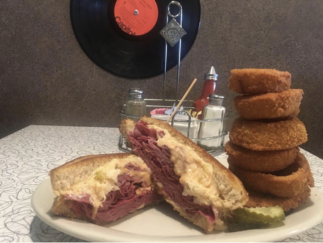 Carryout our Reuben with onion rings today for $10.99!!