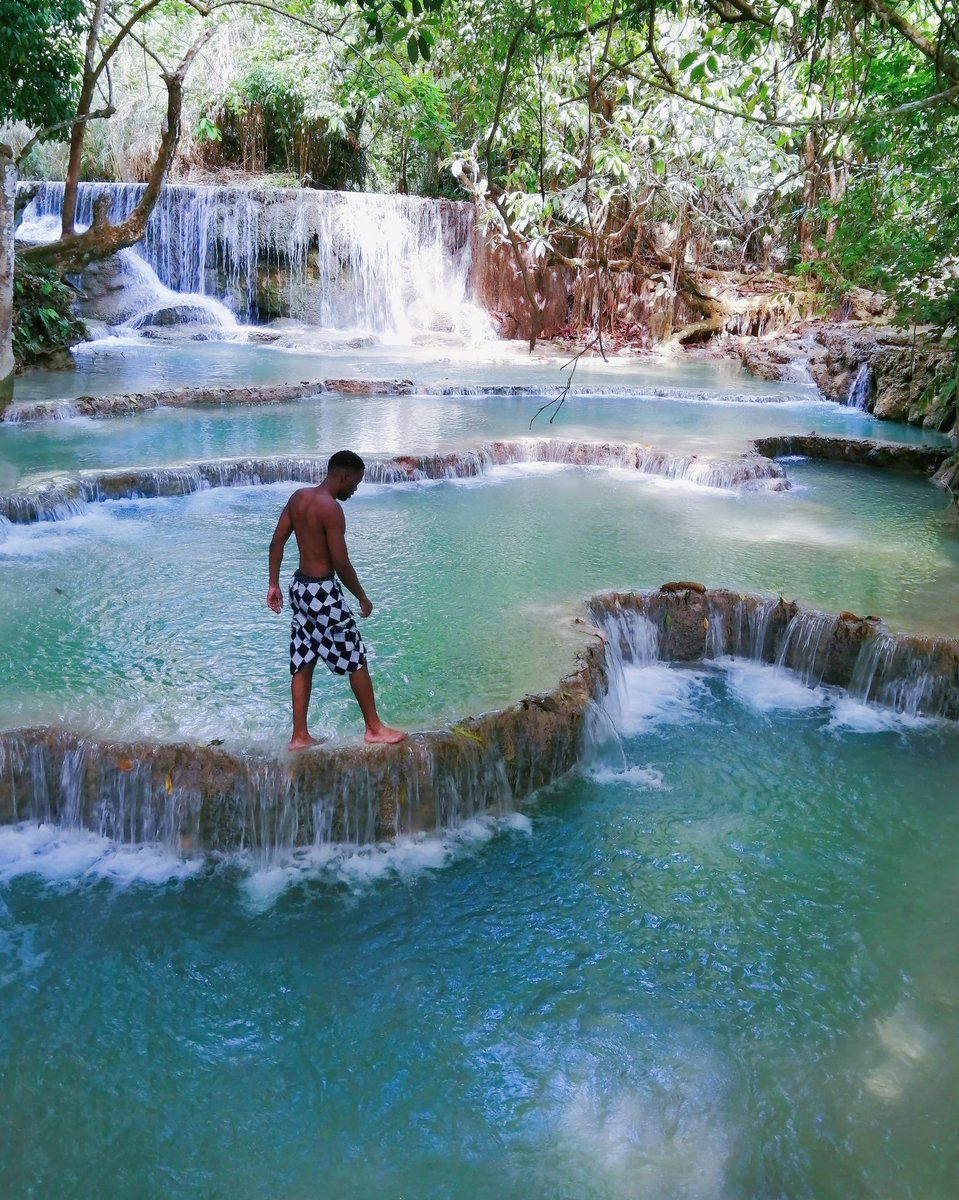 Kuang Si Falls This is the main attraction in Luang Prabang. It's a large cascade of turquoise blue waterfalls, with tiered limestone pools  #21Days21Destinations  #KuangSiFalls  #Laos