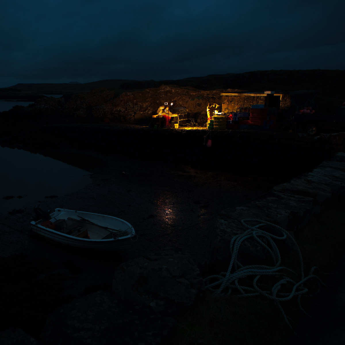 Colin Morrison & Ronan Martin sorting brown crabs in pre-dawn light before the refrigerated lorry comes to collect them, Croig Pier, Isle of Mull, Scotland (2005) #WeAreHighlandsAndIslands  #TheHillsAreAlwaysHere