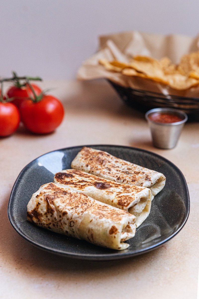 A balanced diet is a burrito in each hand. | Celebrate #NationalBurritoDay with our Wet Burrito and Bean &amp; Cheese. Order curbside pickup located at <a href="/TheNiceGuyLA/">TheNiceGuy</a> or FREE delivery with <a href="/Postmates/">Postmates</a>. #PetiteTaqueria