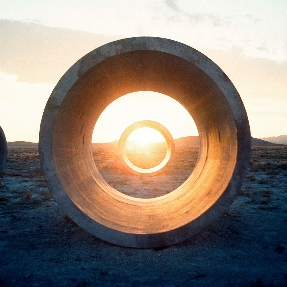 Sutton's tweet image. Today we celebrate #NancyHolt’s birthday 🎂! Holt’s pioneering #LandArt continues to inspire artists and recalibrate the possibilities of what art can be and where it can be found. @HoltSmithson #PromotingCreativity