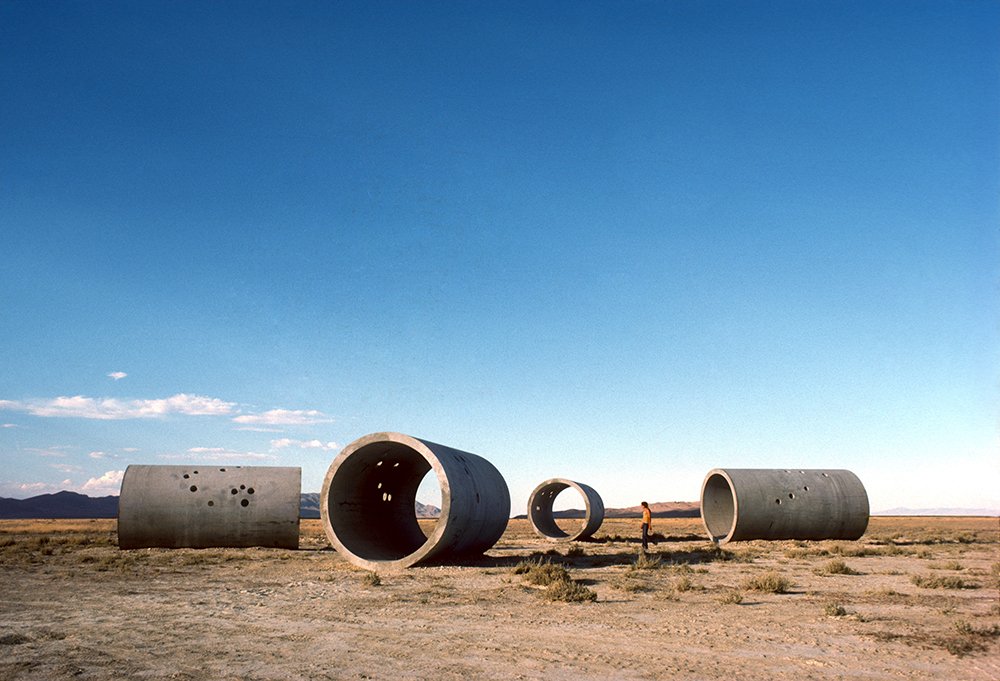 Sutton's tweet image. Today we celebrate #NancyHolt’s birthday 🎂! Holt’s pioneering #LandArt continues to inspire artists and recalibrate the possibilities of what art can be and where it can be found. @HoltSmithson #PromotingCreativity