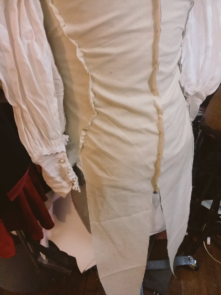 now i'm caught up! to-day i combined a trace-over of lorenz' in-game model with a basic shirt block to create a rough pattern for the waistcoat. i printed it out, then folded, pinned and cut it to be more flattering. i made a muslin of that modified pattern afterward to fit more.