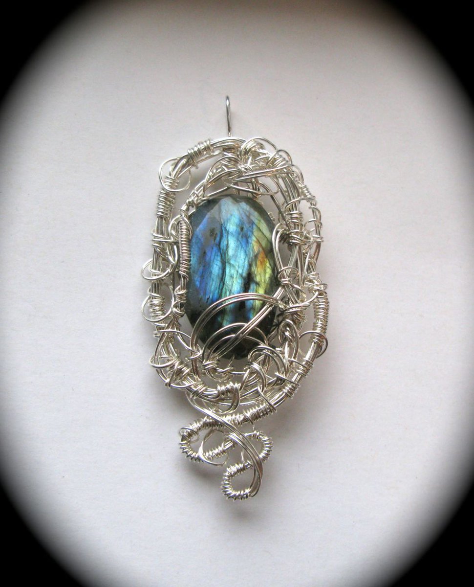 Like the current year, 2019 had dragons springing up off the workbench. This is "Dragon Vigil," which is labradorite and sterling silver.