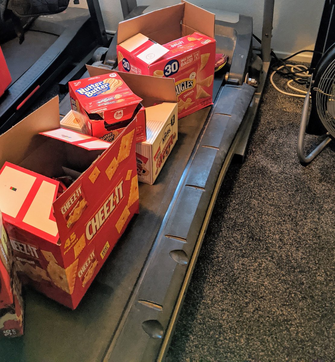 lflores91819's tweet photo. January 2020: This is my year to get ripped!

April 2020: The #pandemic hits and Costco sized snack packs, cheez-it's, bugles, nutter butters, &amp; raspberry cookies are now "kept on the treadmill". 

I guess this is my #QuarantineLife . https://t.co/5RMtTJEGIX