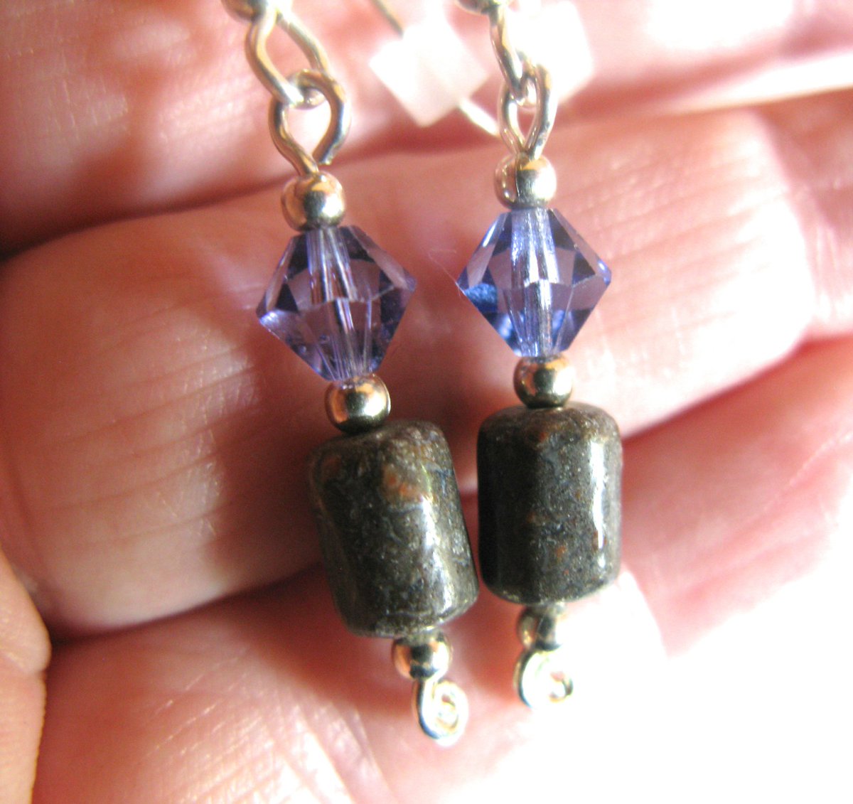 Another pair of earrings, "Thunder Lizards at Twilight," have stayed with me and become my own. (It doesn't happen often -- maybe once every three to five years -- but now and then a piece stays.)