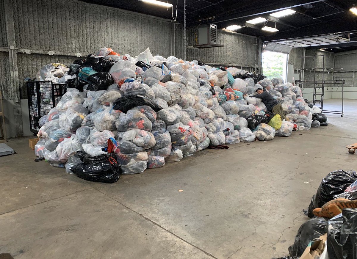 All your stuff in bags is collected from all the bins. The big bulky items are separated and everything is placed into a baler. Those bales are then loaded into ocean containers and sold to processors overseas. This is what the bags look like before baling.