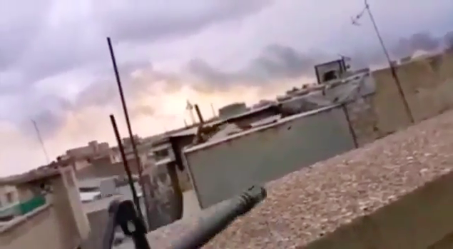 A video recorded in late May shows Abu Sayfullah on a rooftop - literally a grenade's throw away from the advancing Iraqi forces - fighting and speaking to the camera, nearly drowned out by sounds of gunfire around them. 18/23