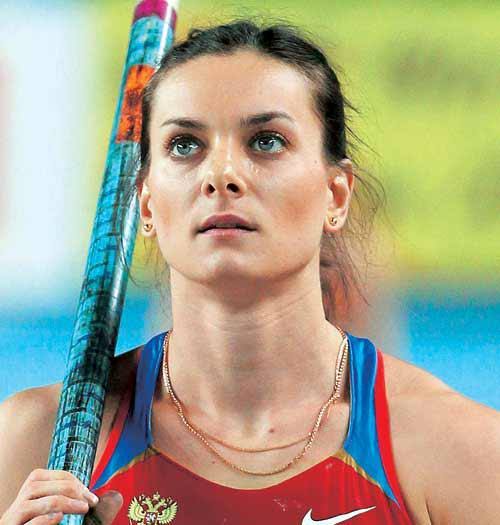 Yelena Yisinbayeva.. 03/06/1982.. RUSSIAN POLE VAULTER.. DOUBLE OLYMPIC CHAMPION.. TRIPLE WORLD CHAMPION.. World record holder 5.06 m.. Olympic record holder 5.05 m... She broke the WORLD RECORD 28 times... Her numbers are the highest in history..