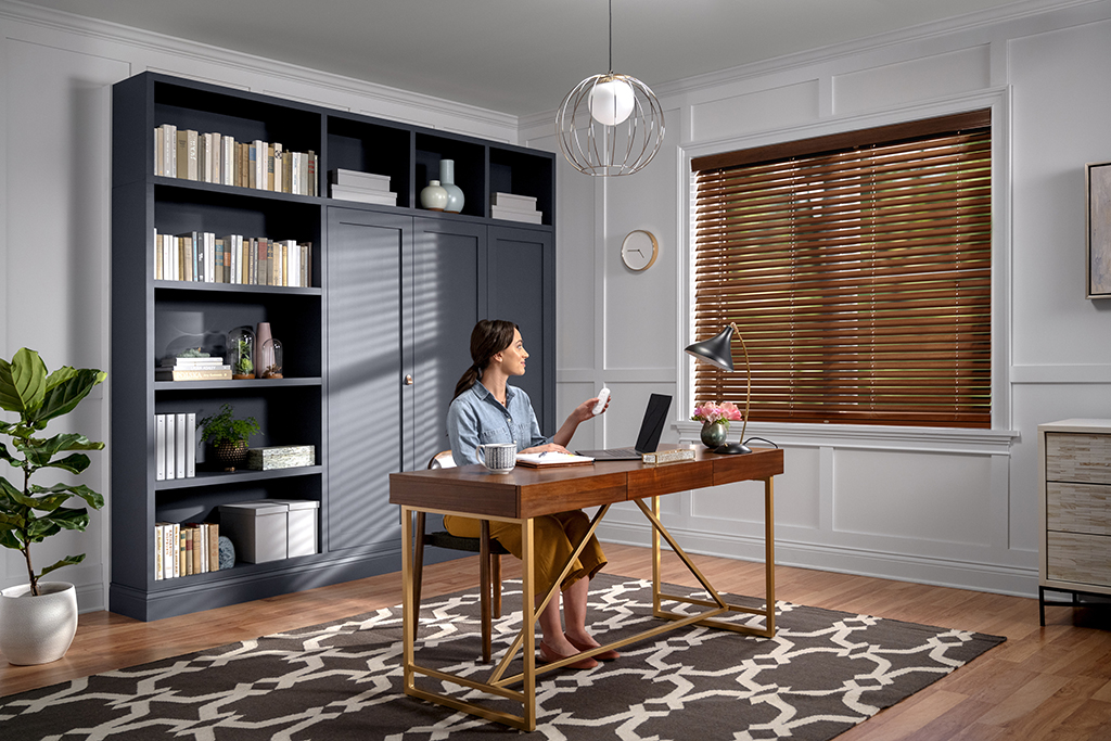 Work smarter. Motorized real wood blinds put light control right at your fingertips so there's no need to leave your desk.  bit.ly/2JvtIb7