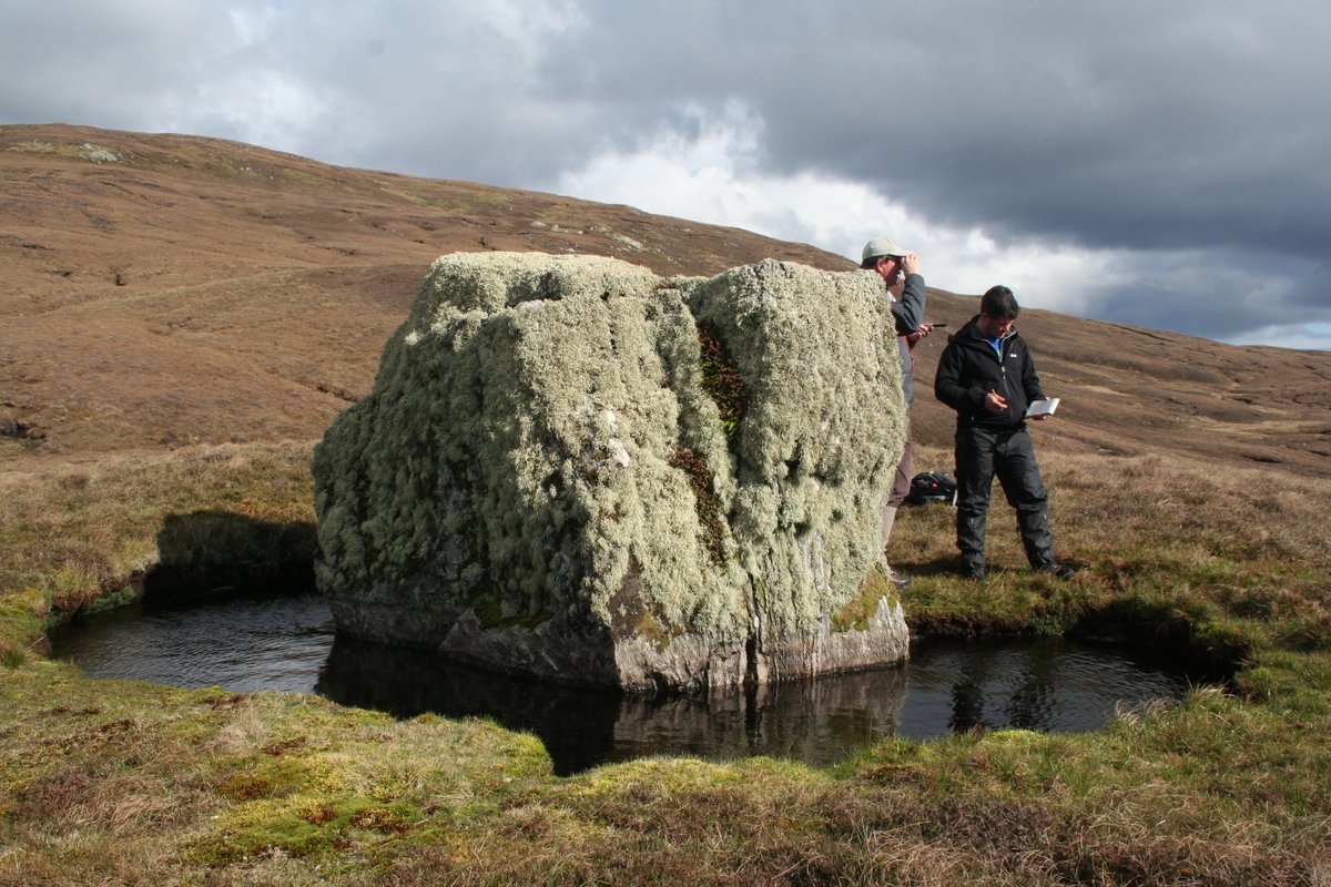 Some boulders come with their own moat to keep out the riff-raff.