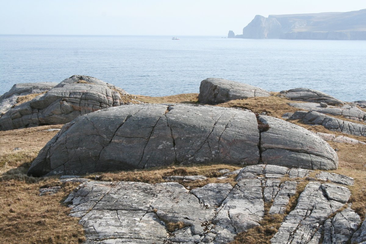 Slightly tenuous but there is a perched boulder in this picture, along with a great backdrop and some mediocre glacial erosion landforms.