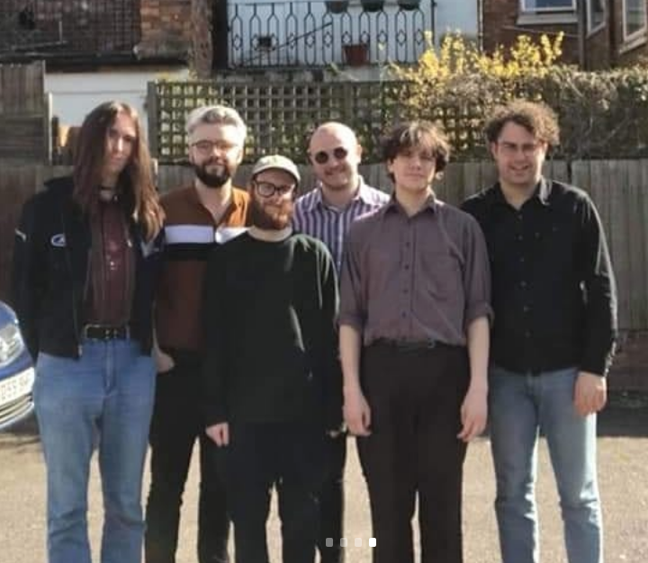 Hello! Let us begin the 5pm listening session for Weird Country. I will press play any second but here's a photo of us escaping for sunlight during the sessions. L to R: Chrinz McCrory, Andrew Mac, Lewis Orr?, Jim Dubber, Sath Evans, Crick Argos