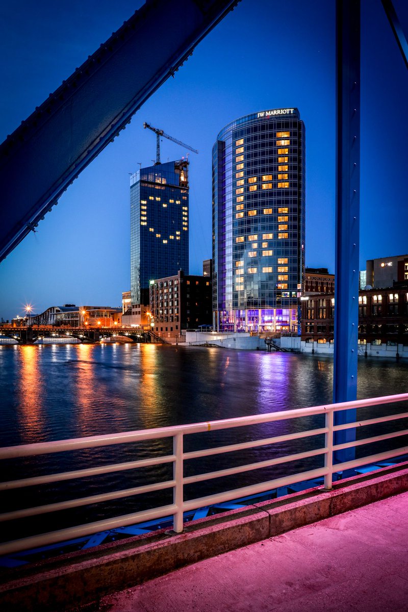 Mbuckstudio's tweet photo. We kept lots of room between us and everyone else as we captured the beautiful lights of downtown Grand Rapids last night.  The JW joined the Amway with a great message of hope and love.   We have a great city!  #USA #CARE #grandrapidsphotography #Architecturephotos #ILOVEGR https://t.co/drGcmv4zpM