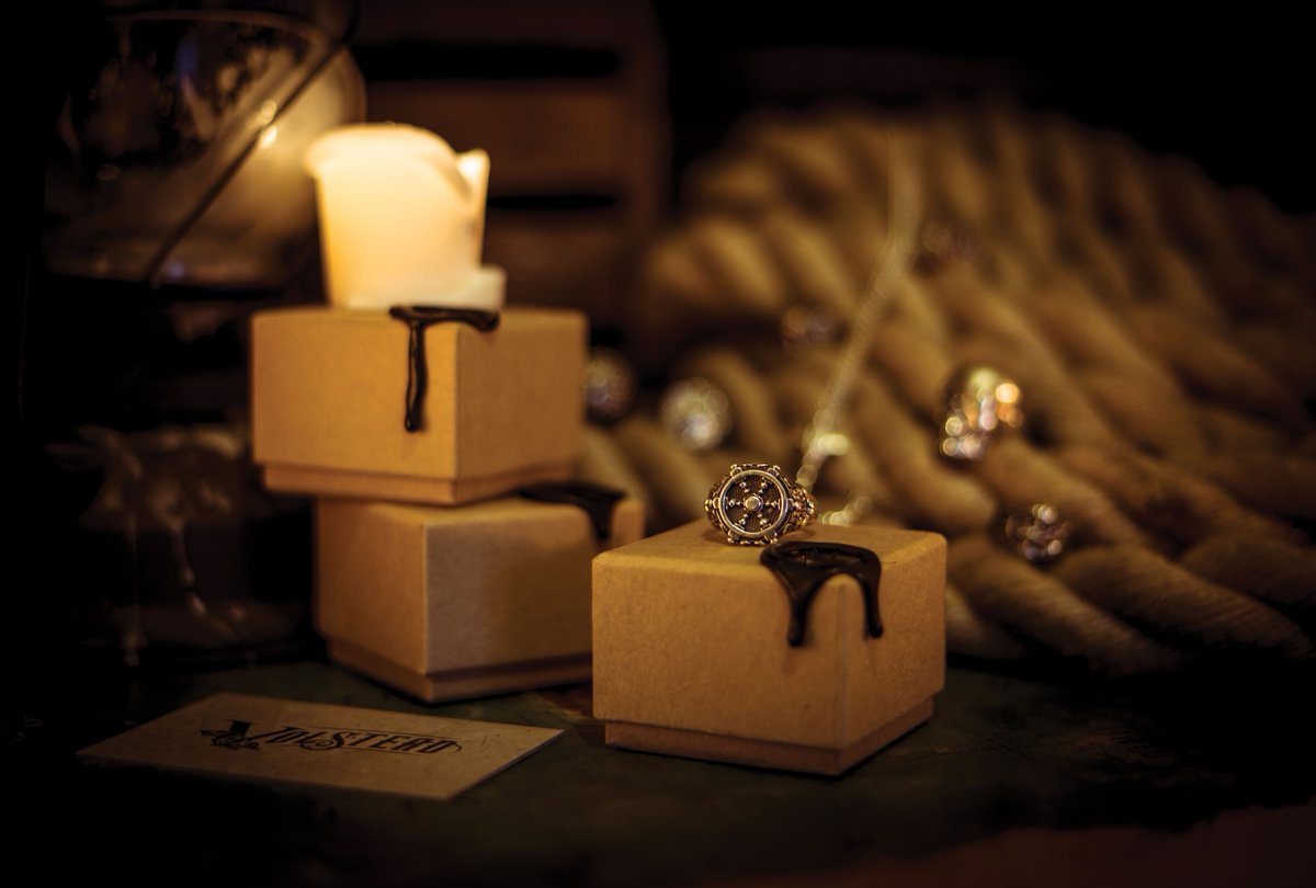 Blackbeard's Helm alongside our packaging boxes, each of which is hand-stamped, making each one individual!