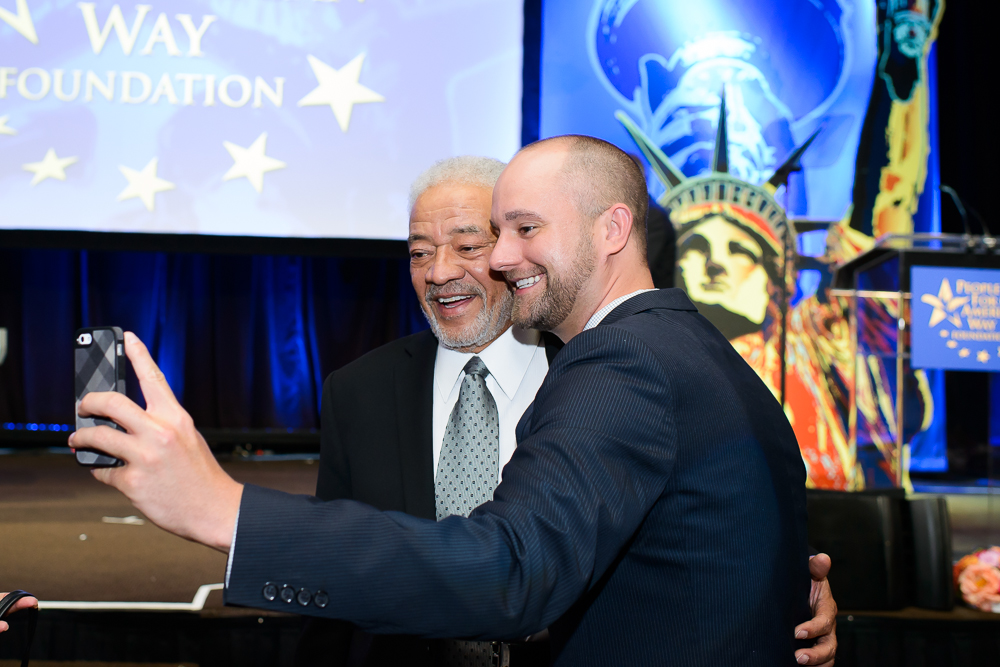 peoplefor's tweet photo. #BillWithers was a force to be reckoned with. For years, PFAW Foundation's @YEOnetwork has been singing his "Lean On Me" as a show of solidarity at the end of their annual convenings. Here he is in 2014 with some of our YEOs.

#RestInPower https://t.co/tKSsjpLeCV