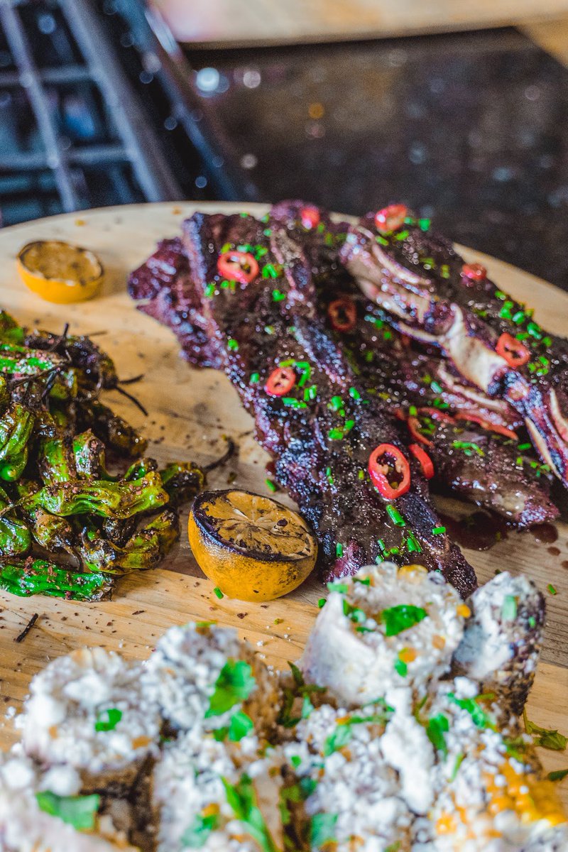 HostGregHutson's tweet photo. Some screen shots from Greg Hamilton’s #WWEats !! Video dropping next week. Sous vide and grilled Asian short ribs, grilled corn with chipotle-lime crema and blistered shishito peppers with Korean Gochugaru chile flakes. 
📸: @palmphotoz https://t.co/nZtzsyS4Hy
