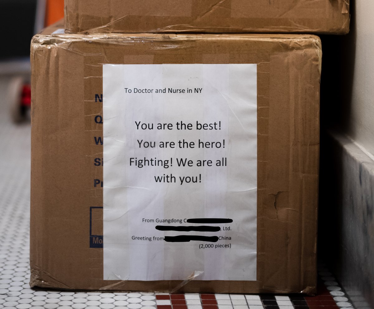 PeterJEavis's tweet photo. I haven't wept since this all began. Then I saw this outside our neighbor's apartment. This person works in one of the area hospitals. Face mask delivery. From China. https://t.co/EG7rpdV8tn