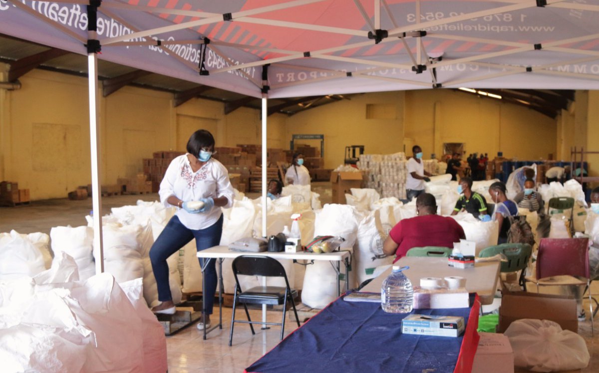 JulietHolness's tweet photo. The team is in the warehouse working for the people. 6000 care packages coming right up, thanks to @SGfja @GraceKennedyGrp  @kendel @NHFJamaica and  @CariMed_JA. We remain grateful to our corporate partners. https://t.co/R4oyb33AtJ