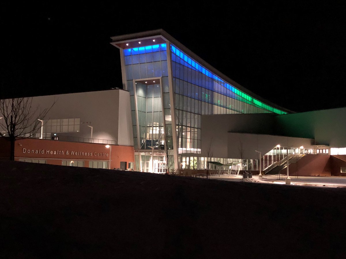 RedDeerPolytech's tweet photo. Thank you to the healthcare workers who are doing their best work caring for our community during COVID-19. Each night, the Gary W. Harris Canada Games Centre is lit in blue and green (@AHS_media colours) to demonstrate our appreciation for these frontline workers. (1/2) https://t.co/UYkkIRiGWY