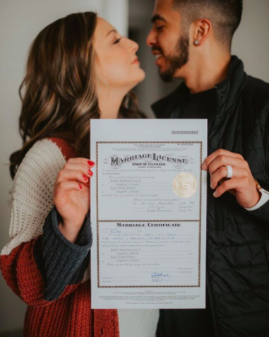WeddingWire's tweet photo. Kayce &amp; Chico postponed their wedding, but made their marriage official by signing the paperwork on their original date. ❤️ To celebrate, they popped champagne and enjoyed some cake! 🍰 {Sincerely Jules Studio} https://t.co/Rx27rBeygu