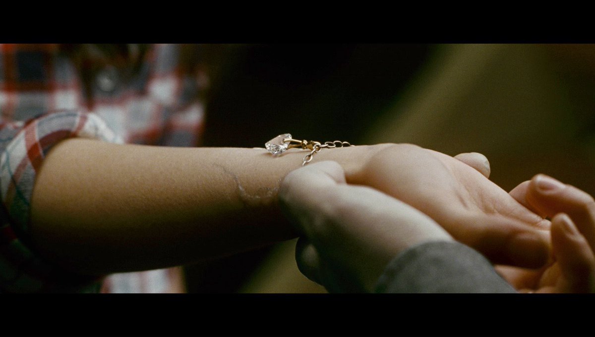 It’s so wack that Edward puts a charm on the bracelet Jake gave Bella. 