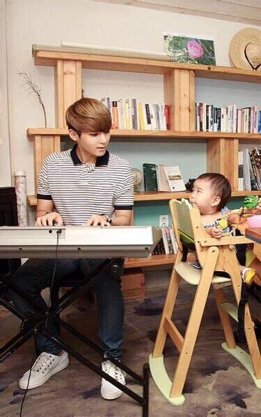 imagine ryeowook playing nursery rhymes on his piano for his children 