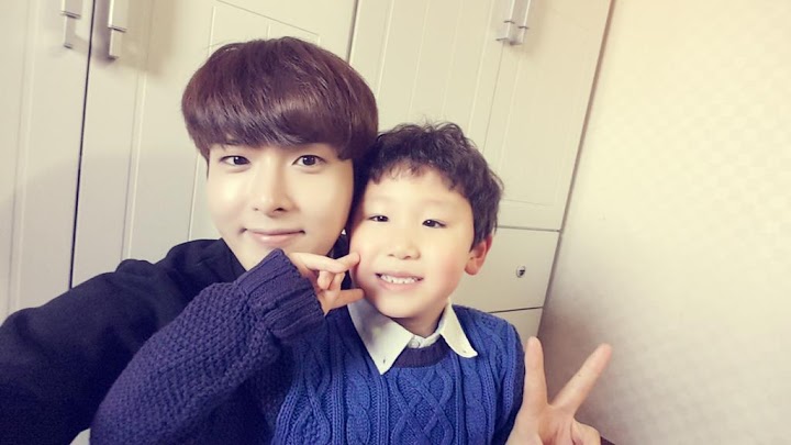 ryeowook is a baby himself,, but i bet he'd slay as a father to his children