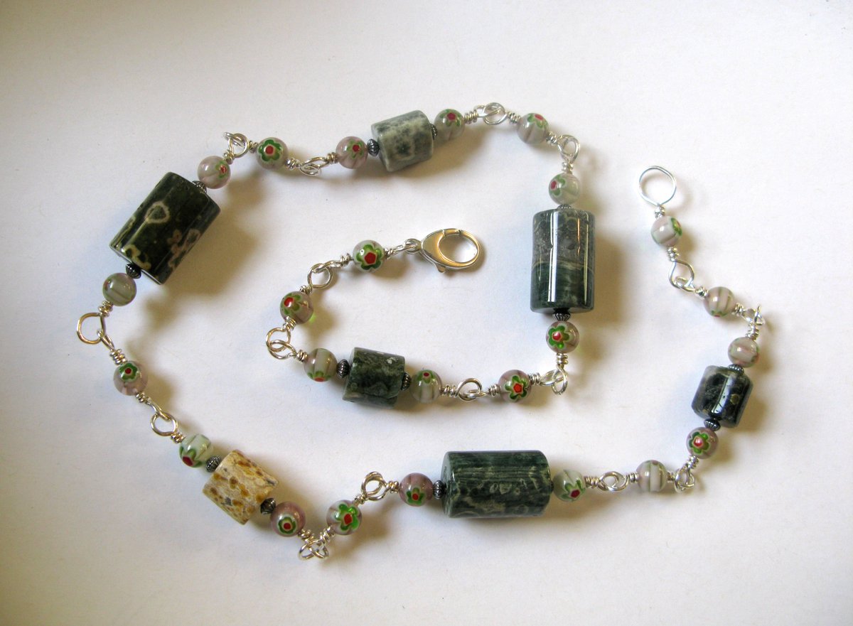 Another 2019 necklace, this one called "Seven Ways of Learning Earth," has little glass beads between the ocean jasper beads.