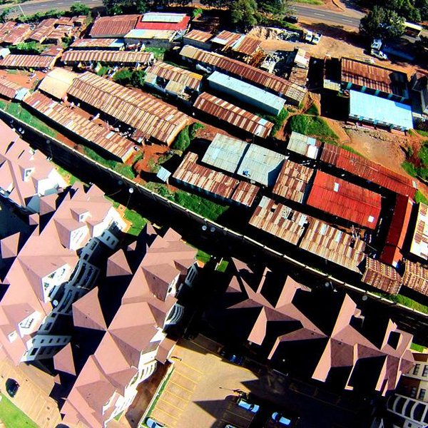 Typical contrast of the rich living side by side with the poor. This is Kangemi in Nairobi, Kenya.