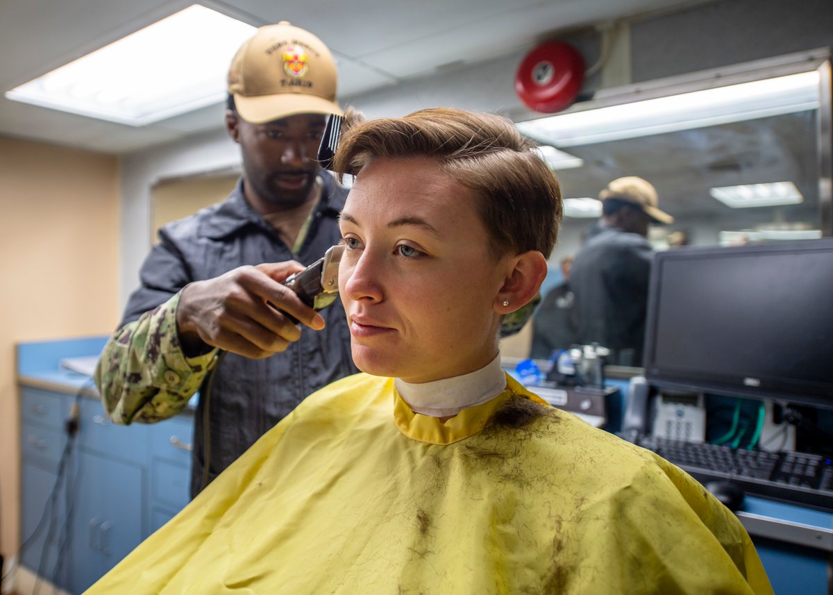 04/03/20  http://WWW.DFNS.TV Hospitalman Abby Musick, from Glasgow, Ky., receives a haircut in the barbershop aboard the hospital ship USNS Mercy (T-AH 19). Mercy will serve as a referral hospital for non-COVID-19 patients.