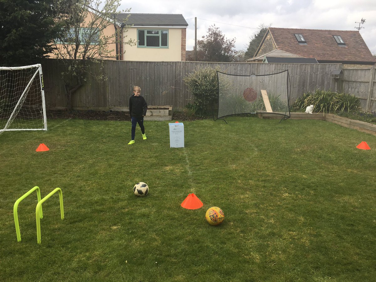 chappers_paul's tweet photo. 4 cones, 1 box, 2 footballs = most competitive dad vs son chipping game in history #dadwon #improvise #weightofpass https://t.co/zhZ484iLfi