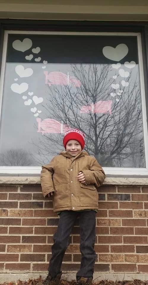 Ozinga's tweet image. Kris Kiley is an Ozinga driver in our Illinois North region. His family wanted to take part in the Heart Hunters Facebook campaign and wanted to do it with an Ozinga ready mix truck. Pictured is his son Kellen.