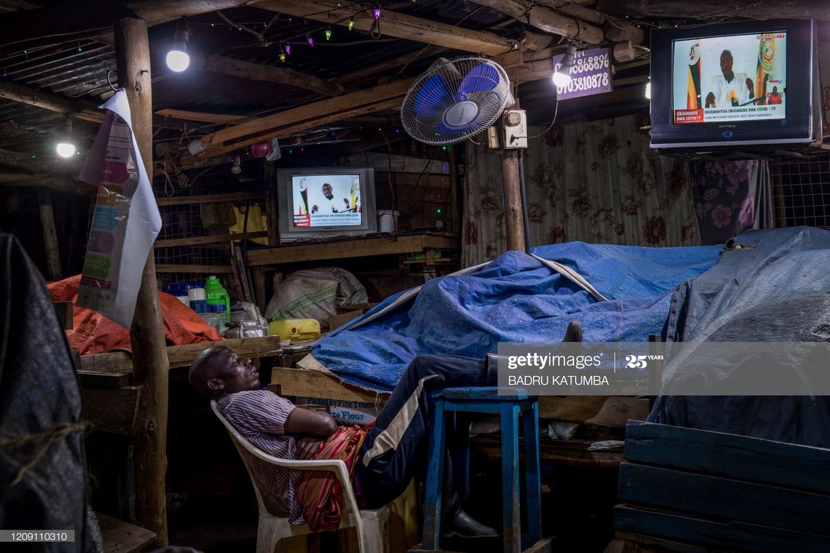 A trader sleeps next to items to be sold at a market following a directive from president Museveni that all vendors should sleep in markets for 14 days to avoid contact with their families to curb the COVID-19 coronavirus in Uganda.  #COVID2019  #COVIDUG